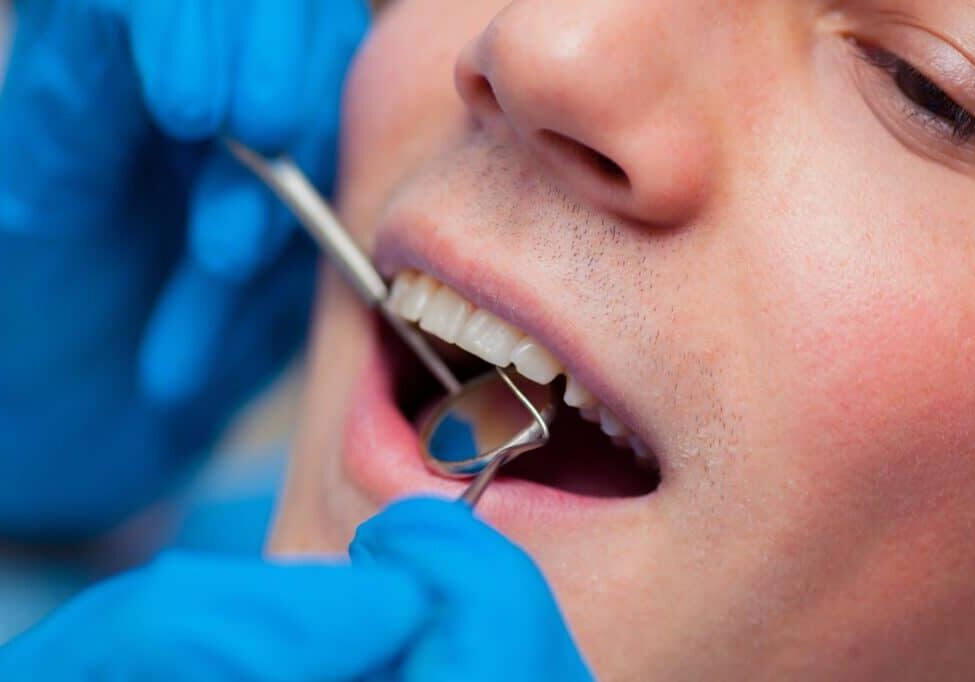 Dentist treatment a patient's teeth in the dentist